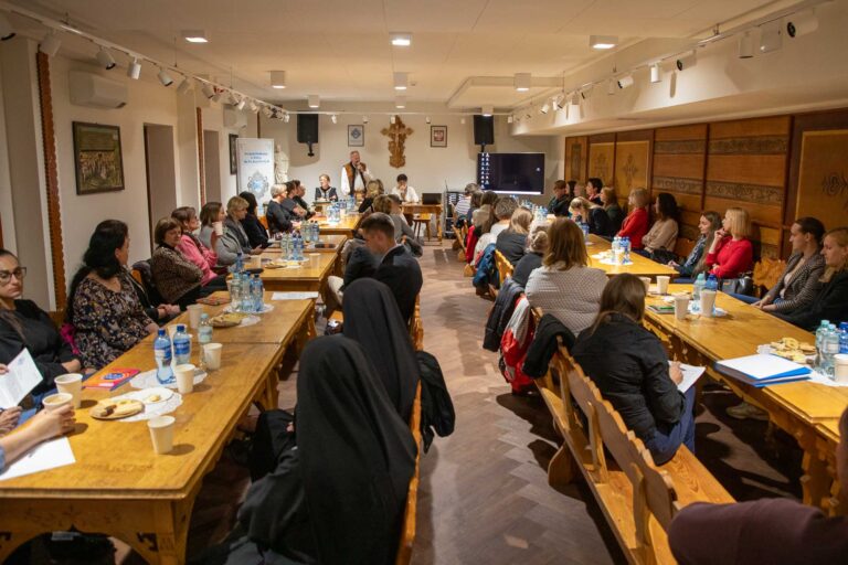a group of people sitting at tables